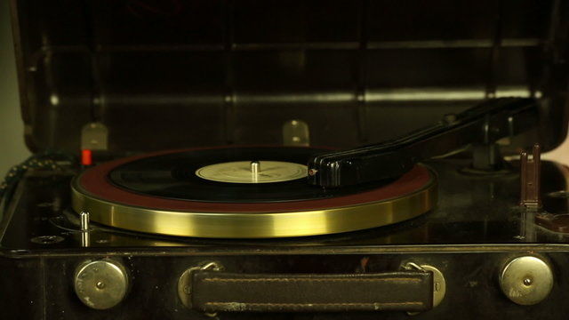 Vintage record player plays vinyl