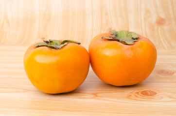 Persimmon on wood plate