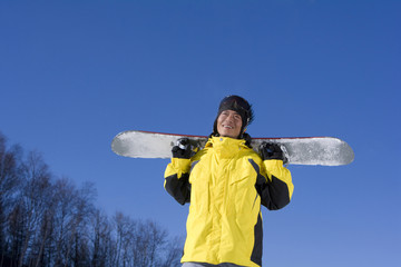 Young man with his snowboard