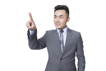 Young businessman using finger to point