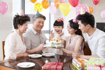 Happy family celebrating birthday