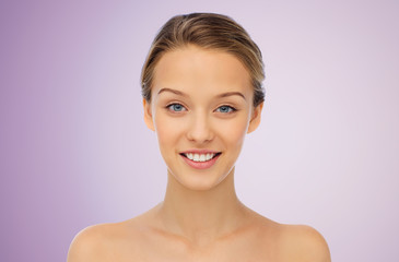 smiling young woman face and shoulders