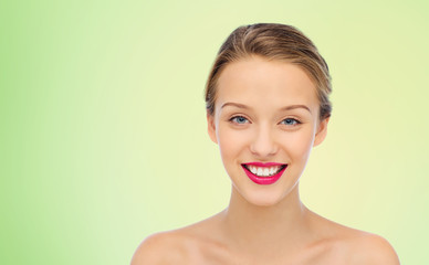 smiling young woman face and shoulders