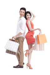 Happy young couple with shopping bags