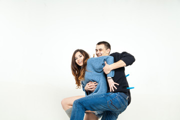 Fototapeta premium Portrait of happy couple isolated on white background. Attractive man and woman being playful.