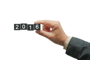 Hand withblack number square dice 2016.