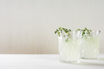 Cocktail in old fashioned glass on the wooden background