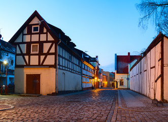  Narrow street with half-timbered residential houses. Market street. Old town of Klaipeda city, Lithuania.