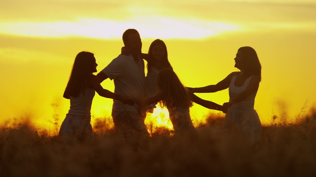 Loving Caucasian Family Together Outdoors Sunrise Carefree Lifestyle Happiness