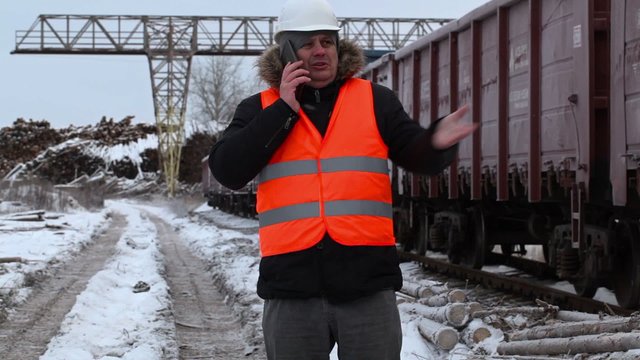 Railway officer using smartphone