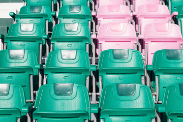 Fototapeta premium plastic stadium seat , green and pink