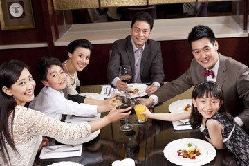 Family having dinner in a luxurious dinning room