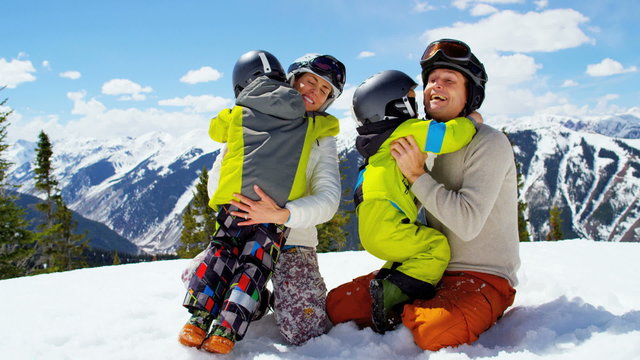 winter ski skiing vacation Caucasian family parents boys activity snow resort