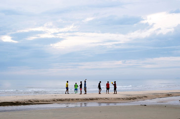 game of football on the beach