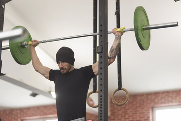 Handsome man working out in the gym