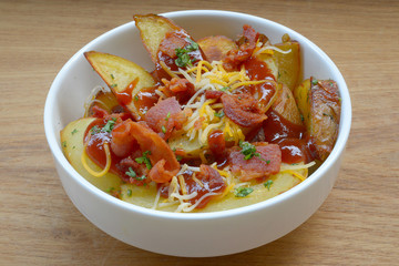 Homemade fried potato with spices and herbs