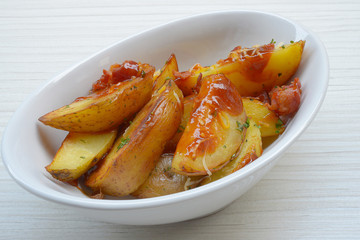 Homemade fried potato with spices and herbs