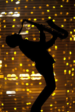Saxophonist. Man playing on saxophone