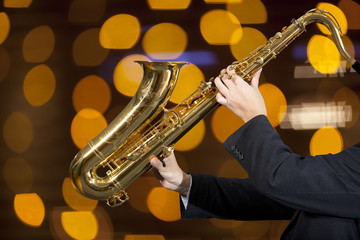 Saxophonist. Man playing on saxophone