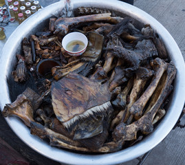 Making medical oils from animal parts to treat sore muscles and joints.