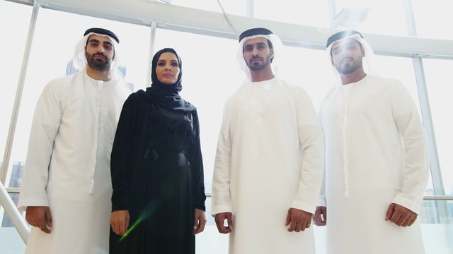 portrait Emirati male female business colleagues meeting office oil development 