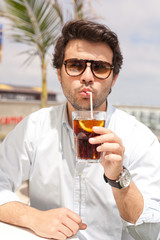 Young man drinking a beverage