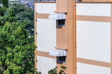 Rainproof awning of slide window on sunny day. © Eakkaluk
