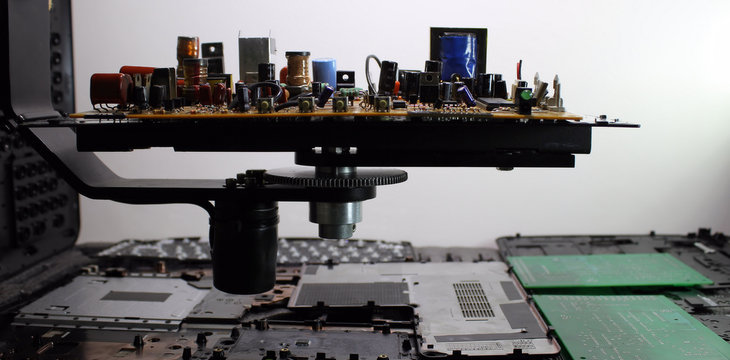 Radio components on rotation electronic board at electronics factory