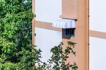 Rainproof awning of slide window on sunny day. © Eakkaluk