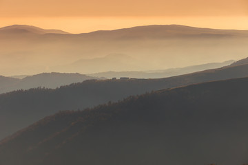 Sunset in the mountains in orange tones
