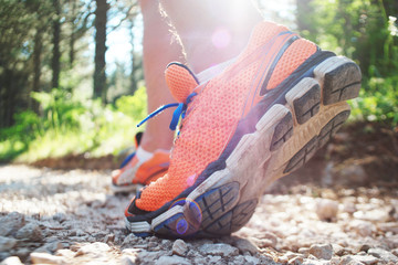 Close up of man walking on nature trail near forest preserve. Co