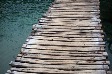 Fototapeta premium Timber walkway across lake