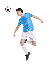 Soccer player jumping, kicking behind him