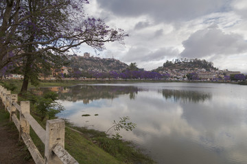 Lac Anosy famous landmark in Antananarivo, Madagascar on a lake reflection cityscape.