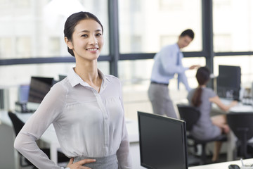Portrait of young businesswoman in office