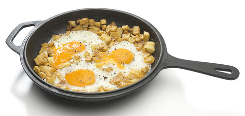 Homemade potato omlette in cast iron cooking pan isolated