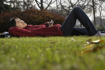 Young Man Laying In A Park