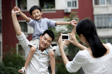 Young Chinese family taking pictures
