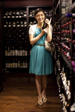 Young woman shopping in cellar