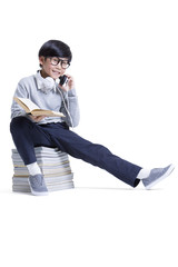 Cute boy with headphone reading