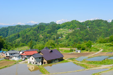 Fototapeta na wymiar Northern Alps and village in Nagano, Japan