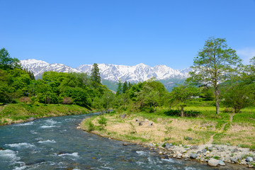 Shirouma mountains and Himekawa river at Ooide park in Hakuba, Nagano, Japan