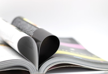 Pages of a book curved into a heart shape, love concept