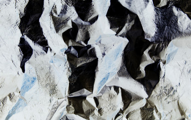 background brilliant silver foil crumpled broken line abstraction