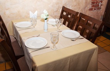 glasses and plates on table