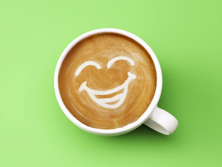Face Laughing Coffee Cup Concept isolated on green background - obrazy, fototapety, plakaty
