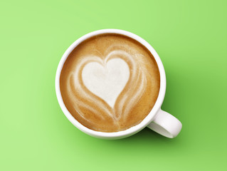 Heart Shape Coffee Cup Concept isolated on green background
