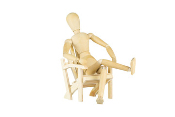 Wooden mannequin on a wooden chair