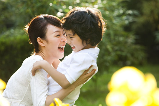 Mother and son playing outdoors