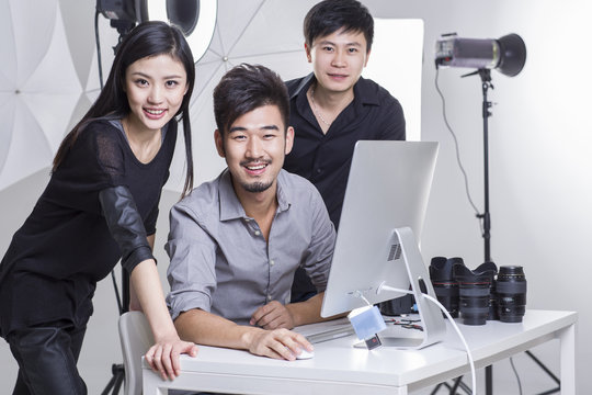 Portrait of photographers working in studio